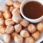 Air Fryer Churro Bites – Golden, crispy mini churros coated in cinnamon sugar and served with a side of chocolate dipping sauce.