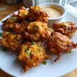 crispy crawfish beignets with jalapeno cheddar dip