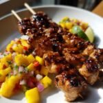 spicy honey garlic chicken skewers with mango salsa